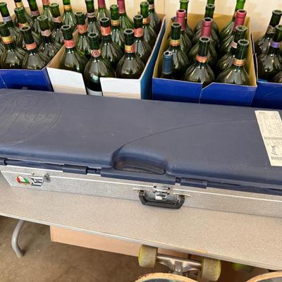 Sale Photo Thumbnail #1182: 1 Beretta plastic & 1 metal rifle Case w/some contents