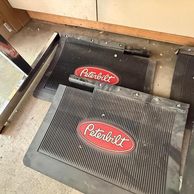 Sale Photo Thumbnail #1379: 2 Sets of Peterbilt Mud Flaps. Appear to be unused