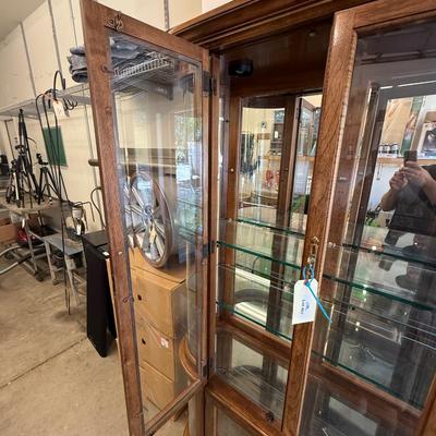 Sale Photo Thumbnail #1599: Wood & Glass Oval Curio Cabinet 77”x15”49” lighted