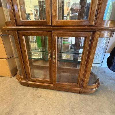 Sale Photo Thumbnail #1598: Wood & Glass Oval Curio Cabinet 77”x15”49” lighted