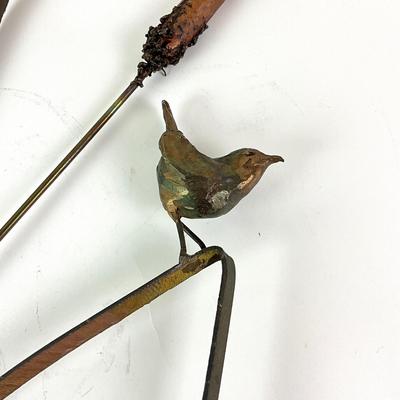 Sale Photo Thumbnail #1380: Comes with nails for display on wall
Measures: 3' 4" high x 19" wide
Late 20th century bronze bird sculpture with rushes and reed titled "Nuthatch" by Georgia Gerber  ; cast of the artist's foundry on Whidbey Island, Washington; wall hung; very good condi