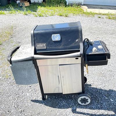 Sale Photo Thumbnail #1408: Comes with grill cover, condition is fair; had prior use.
Has burner rack on back with grill brush and propane hook up hose