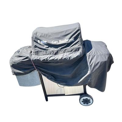 Sale Photo Thumbnail #1406: Comes with grill cover, condition is fair; had prior use.
Has burner rack on back with grill brush and propane hook up hose