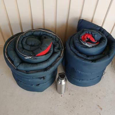 Pair of Vintage Blue Sleeping Bags with Red Interior