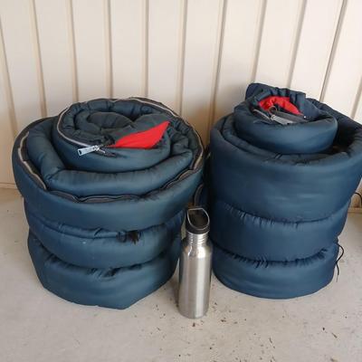 Pair of Vintage Blue Sleeping Bags with Red Interior