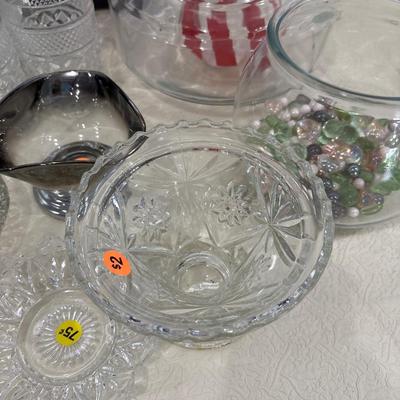 Black shelf, plate rack, dishes, and art