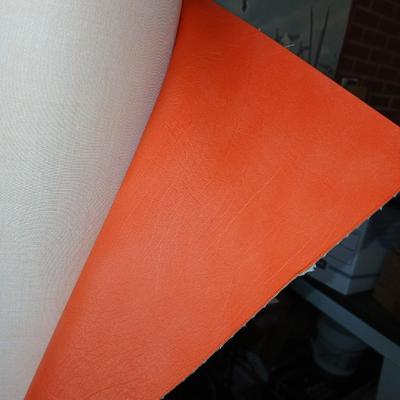 Large Roll of Orange Textured Vinyl Upholstery Fabric