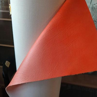 Large Roll of Orange Textured Vinyl Upholstery Fabric