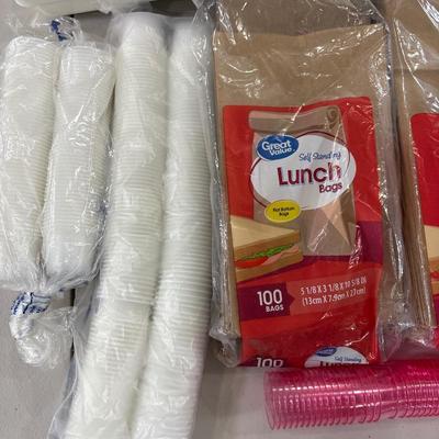 Paper and plastic goods with silverware and drawer organizer