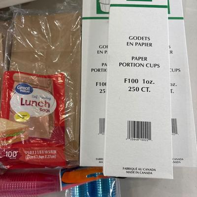 Paper and plastic goods with silverware and drawer organizer