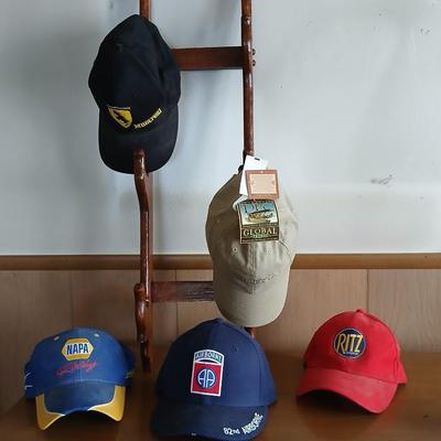 Branded & Military Cap Lot – Ferrari, NAPA, Ritz, 82nd Airborne + More with hat rack