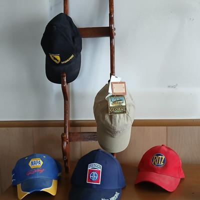 Branded & Military Cap Lot – Ferrari, NAPA, Ritz, 82nd Airborne + More with hat rack