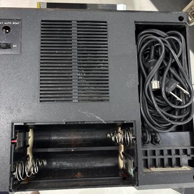 Vintage Holiday 8-track stereo with a case and tapes