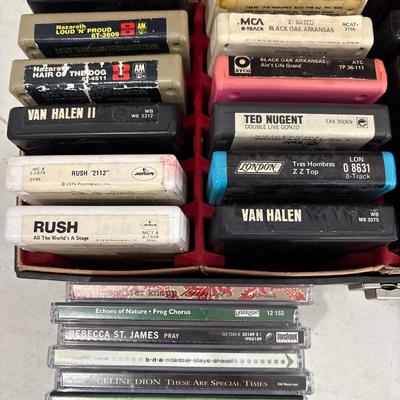 Vintage Holiday 8-track stereo with a case and tapes