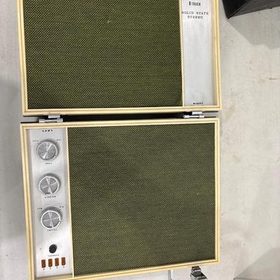 Vintage Holiday 8-track stereo with a case and tapes