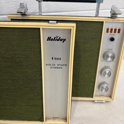 Vintage Holiday 8-track stereo with a case and tapes