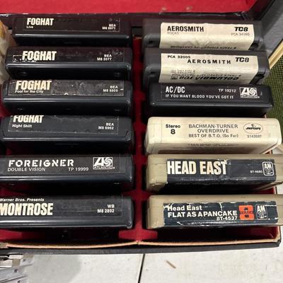 Vintage Holiday 8-track stereo with a case and tapes