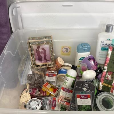 Yoga mat, tote full of lotions and hair product and candle melt
