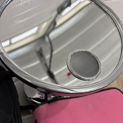 Make up mirror, notebook, bags, and pens, pencils