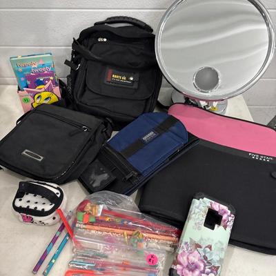 Make up mirror, notebook, bags, and pens, pencils