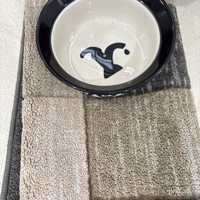Small dog carrier, dog bowl, and rug