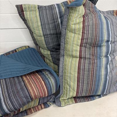 Bedspread and two pillows with shams