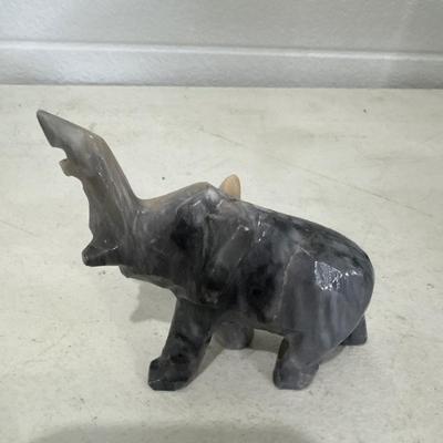 Toy car, marbles, and marble elephant