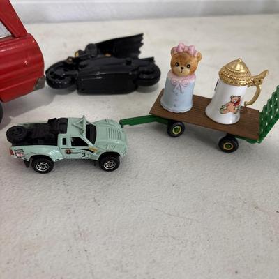 Toy car, marbles, and marble elephant