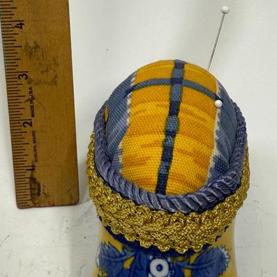 Sale Photo Thumbnail #386: Originally a ceramic planter or vase, decorated and modified to be a pincushion. Good condition, approx. 7" long and 4" high.