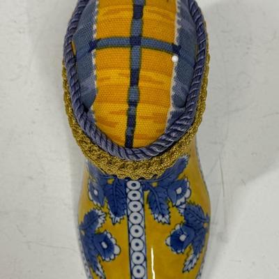 Sale Photo Thumbnail #388: Originally a ceramic planter or vase, decorated and modified to be a pincushion. Good condition, approx. 7" long and 4" high.