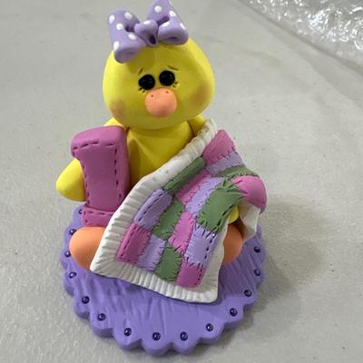 Polymer clay figurines with rug mats in tote