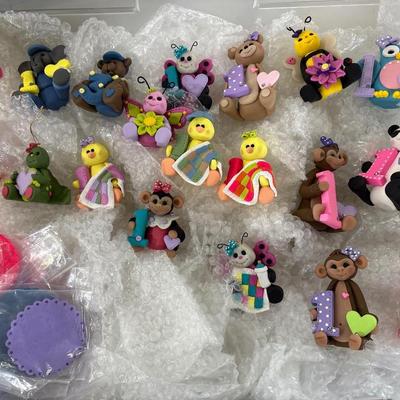Polymer clay figurines with rug mats in tote