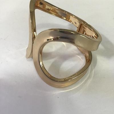 Very nice gold tone hinged cuff bracelet