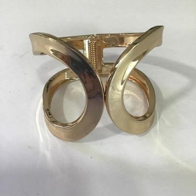 Very nice gold tone hinged cuff bracelet