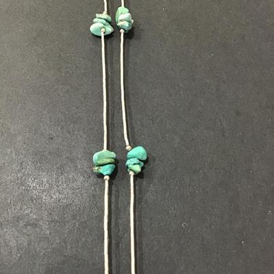 Silver tone necklace with turquoise type stone with bear wind, chime pendant