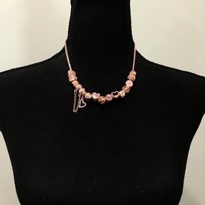 Beautiful rose, gold, toned charm bead necklace very nice