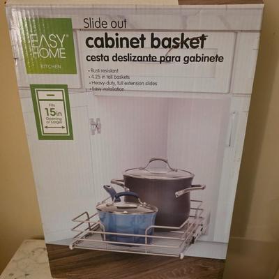 Slide out cabinet basket