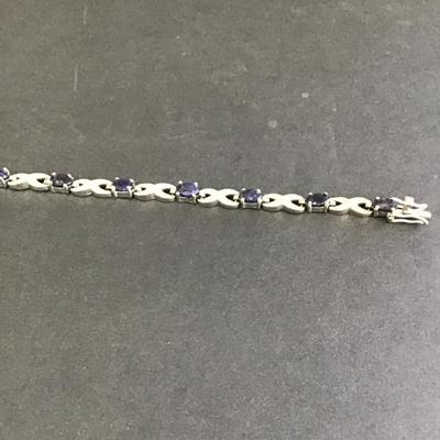 Very nice SilverTone tennis bracelet with deep, purple rhinestones