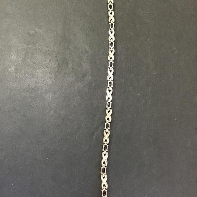 Very nice SilverTone tennis bracelet with deep, purple rhinestones