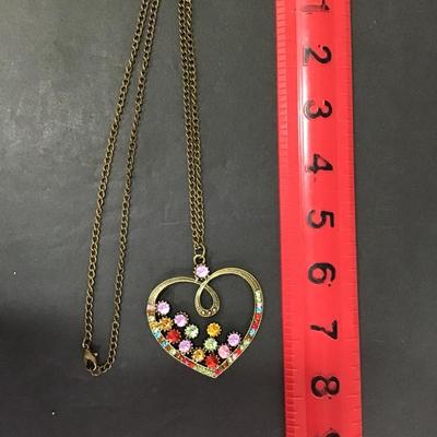 Bronze tone chain with star, gold, toned pendant, with multi colored rhinestones