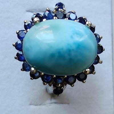 Larimar cabochon with sapphire surround ring