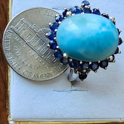 Larimar cabochon with sapphire surround ring
