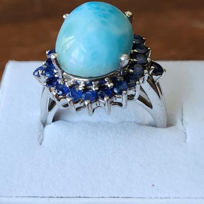 Larimar cabochon with sapphire surround ring