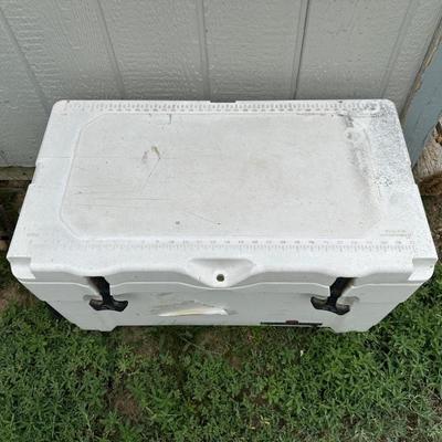 2 FISHING POLES WITH REELS AND A COOLER
