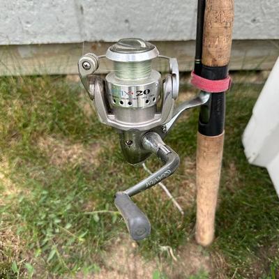 2 FISHING POLES WITH REELS AND A COOLER