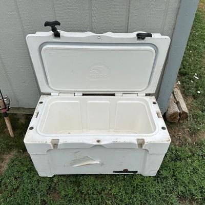 2 FISHING POLES WITH REELS AND A COOLER