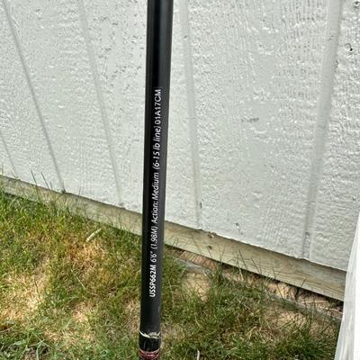 2 FISHING POLES WITH REELS AND A COOLER