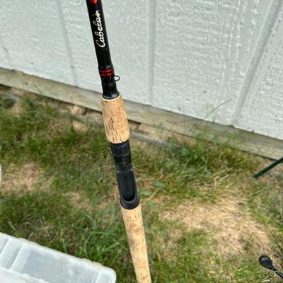 FISHING POLES, REELS AND SECTIONED CABELA'S BOXES