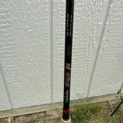 FISHING POLES, REELS AND SECTIONED CABELA'S BOXES