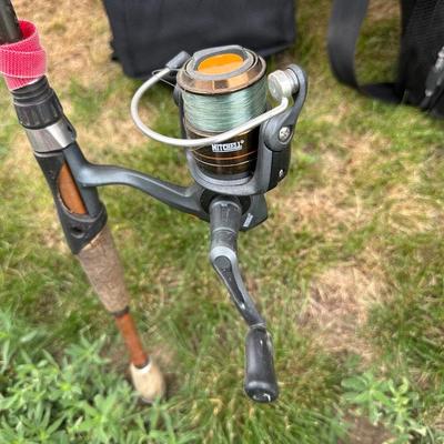 FISHING POLES WITH REELS, SOFT SIDED TITAN COOLER AND AN AUTO TRASH BIN